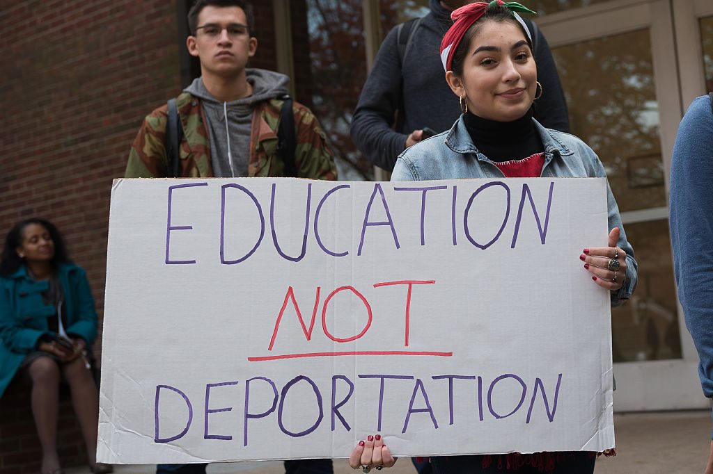 students on strike holding banners says education not deportation